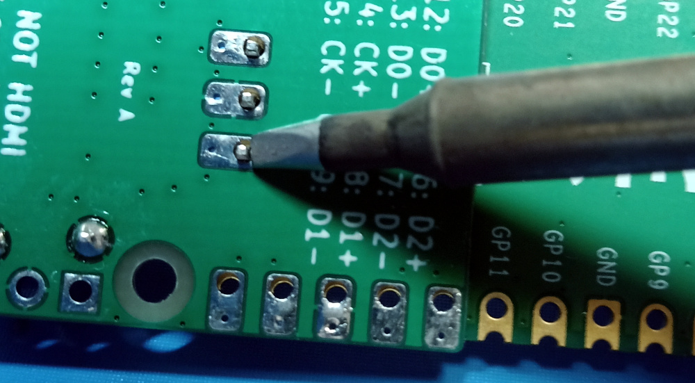 Because the sock board is quite thin, a header pushed through the holes on both boards can still be through-hole soldered from the back, in the way you would normally solder at through-hole header.